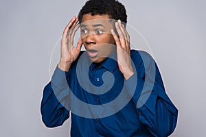 Surprised African American teenager is agitated