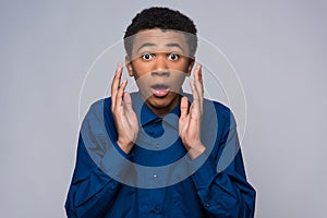 Surprised African American teenager is agitated photo