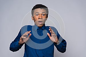 Surprised African American teenager is agitated photo