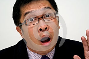 Surprised asian businessman