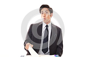 Surprised Asian businessman