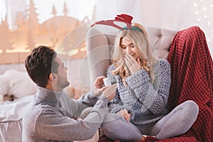 Surprised astounded woman looking at the engagement ring