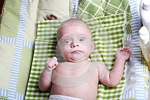 surprised baby boy after bath