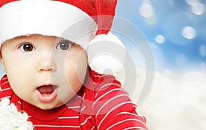 Surprised baby in Santa hat having fun, Christmas