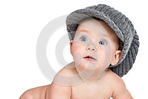 Surprised baby in a winter hat