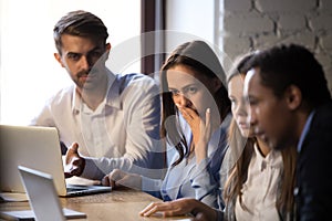 Surprised baffled diverse colleagues received bad news by email