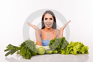 Surprised beautiful girl on a diet with vegetables