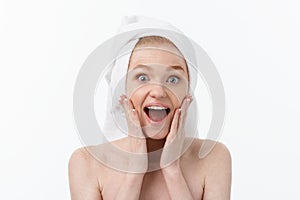 Surprised Beautiful Young Woman After Bath with A Towel On Her Head Isolated On white Background. Skin Care And Spa