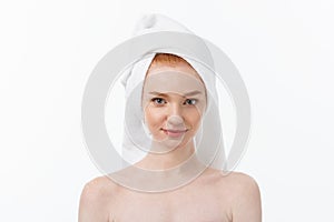 Surprised Beautiful Young Woman After Bath with A Towel On Her Head Isolated On white Background. Skin Care And Spa