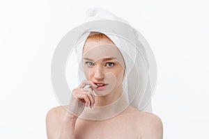 Surprised Beautiful Young Woman After Bath with A Towel On Her Head Isolated On white Background. Skin Care And Spa