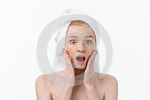 Surprised Beautiful Young Woman After Bath with A Towel On Her Head Isolated On white Background. Skin Care And Spa