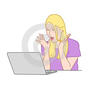 Surprised blond girl with open mouth looks in laptop computer. A