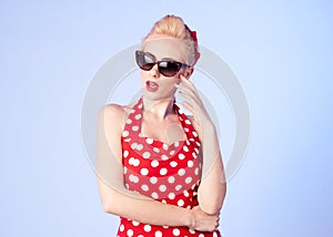 Surprised pin up girl with a vintage dress