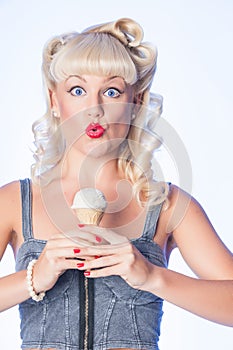 Surprised blue eyed fifties style retro pinup with ice cream cor