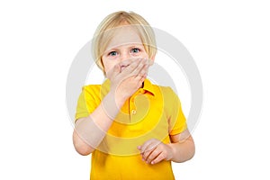 Surprised boy closes his mouth with his hand