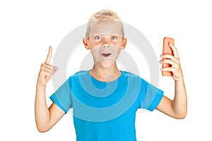 Surprised boy holding smartphone