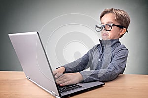 Surprised boy on the internet with laptop computer