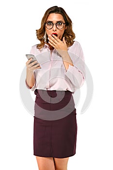 Surprised business woman with smartphone