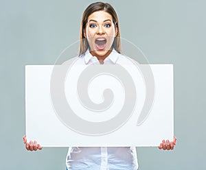 Surprised business woman with white blank sign board