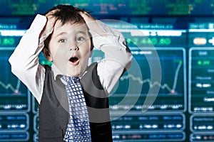 Surprised businessman child in suit, stock marke