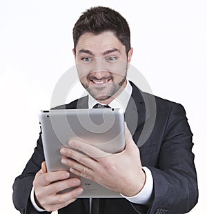 Surprised businessman holding tablet