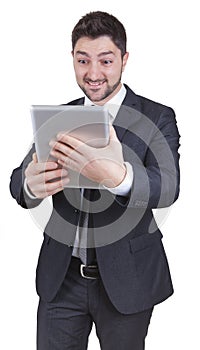 Surprised businessman holding tablet
