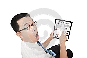 Surprised Businessman using a touch pad pc