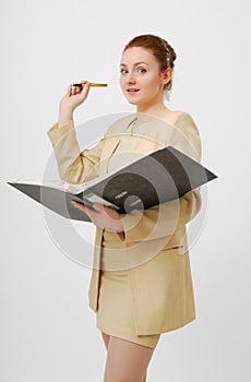 Surprised businesswoman with open folder