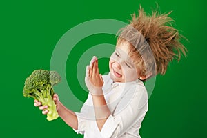 Surprised child against green chalkboard in class