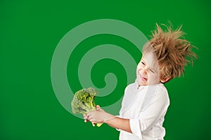 Surprised child against green chalkboard in class