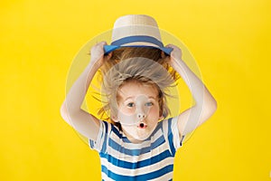 Surprised child against yellow background