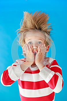 Surprised child holding Christmas gift