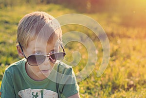 Surprised child in sunglasses