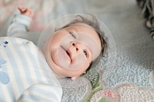 Surprised child. surprised kid sitting at table. child`s eyes widened and mouth opened in amazement. copy space for your text