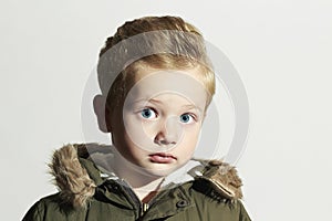 Surprised child in winter coat. fashion kid.children.khaki parka.little boy