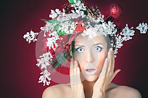 Surprised Christmas winter woman with tree hairstyle and makeup