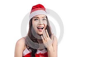 Surprised christmas woman wearing a santa hat isolated on white