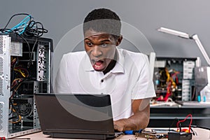 Surprised computer technician