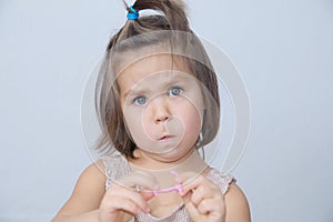 Surprised and disconcerted little girl portrait. child funny face with expressive emotion. emotional toddler frightened