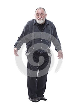 Surprised elderly man showing his empty pockets