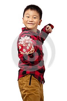 Surprised and excited kid holding christmas gift box with smile