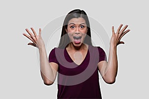 Surprised, excited, thrilled, joyous woman portrait isolated on white, throwing hands in air with jaw dropped photo
