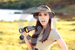 Surprised Explorer Girl with Camouflage Hat and Binoculars