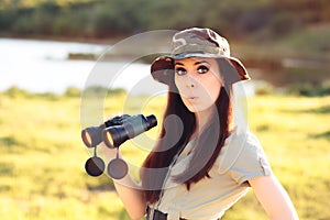 Surprised Explorer Girl with Camouflage Hat and Binoculars