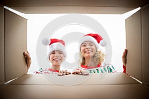 Surprised family unpack Christmas gift box