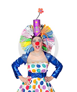 Surprised girl clown with a big colorful wig