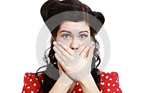 Surprised girl covering her mouth by the hands