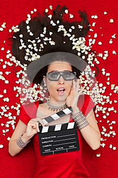 Surprised Girl with 3D Cinema Glasses, Popcorn Director Clapboard photo