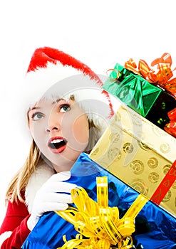 Surprised girl with a lot of Christmas presents