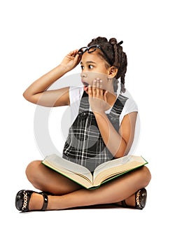 Surprised girl reading a book